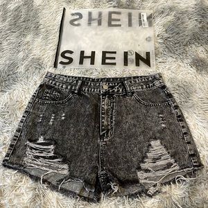 black ripped jean shorts